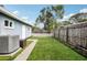 Spacious backyard with a manicured lawn and a charming white picket fence at 1901 66Th N Ave, St Petersburg, FL 33702
