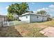 Fenced backyard offering privacy with a well-maintained lawn at 1901 66Th N Ave, St Petersburg, FL 33702
