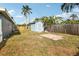 Fenced backyard featuring a storage shed, well-maintained lawn, and a paver patio at 1901 66Th N Ave, St Petersburg, FL 33702