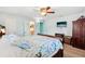 Serene bedroom featuring a comfortable bed, TV, and door to bathroom at 1901 66Th N Ave, St Petersburg, FL 33702