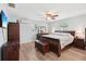 Comfortable bedroom with hardwood floors, dresser, and chest at 1901 66Th N Ave, St Petersburg, FL 33702