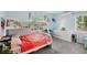 Bright bedroom features a bunk bed, a large dresser, and cozy carpet flooring at 1901 66Th N Ave, St Petersburg, FL 33702
