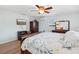 Charming bedroom with a ceiling fan, wood floors and a TV for relaxing at 1901 66Th N Ave, St Petersburg, FL 33702