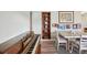 Cozy dining room showcasing a wooden piano, decorative shelves, and a white dining table at 1901 66Th N Ave, St Petersburg, FL 33702