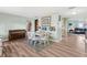 Inviting dining area with a piano, table with seating, and views into the living room and kitchen at 1901 66Th N Ave, St Petersburg, FL 33702