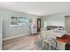 Inviting dining area with large window, natural light, piano, and comfortable seating at 1901 66Th N Ave, St Petersburg, FL 33702