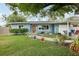 Charming single-story home with well-maintained lawn and landscaped garden beds at 1901 66Th N Ave, St Petersburg, FL 33702