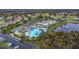 Overhead view of community amenities including a pool, tennis courts, and clubhouse at 1922 Sifield Greens Way # 47, Sun City Center, FL 33573