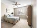 Bedroom featuring a ceiling fan, shuttered windows, and a light color scheme at 1922 Sifield Greens Way # 47, Sun City Center, FL 33573