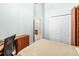 Bright bedroom featuring a view into the Primary bath, and a closet with white paneled doors at 1922 Sifield Greens Way # 47, Sun City Center, FL 33573