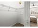 Empty carpeted closet with wire shelving at 1922 Sifield Greens Way # 47, Sun City Center, FL 33573