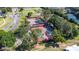 Aerial shot of community tennis courts showing the playing surface and surroundings at 1922 Sifield Greens Way # 47, Sun City Center, FL 33573