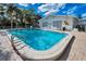 Sparkling community pool with clear blue water and ample space for relaxation at 200 Glennes Ln # 201, Dunedin, FL 34698