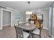 Charming dining area with a modern pendant light and cozy seating for four at 200 Glennes Ln # 201, Dunedin, FL 34698