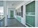 Inviting building entrance with muted, modern colors creates a welcoming first impression at 200 Glennes Ln # 201, Dunedin, FL 34698