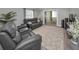 Comfortable living room with a large sofa and plenty of natural light at 200 Glennes Ln # 201, Dunedin, FL 34698