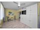Bright living room area featuring hard wood floors, lots of closet space, and natural light at 200 Glennes Ln # 201, Dunedin, FL 34698