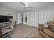 Inviting living room with hard wood floors, ceiling fan, cozy seating and lots of closet space at 200 Glennes Ln # 201, Dunedin, FL 34698