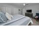 A main bedroom with gray decor, a ceiling fan, and plenty of closet space at 200 Glennes Ln # 201, Dunedin, FL 34698