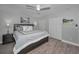 Comfortable main bedroom with a queen size bed, ceiling fan, and closet at 200 Glennes Ln # 201, Dunedin, FL 34698