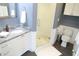 Bathroom featuring granite countertops, a glass-enclosed shower, and tile flooring at 205 N Westland Ave, Tampa, FL 33606