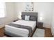 Bedroom featuring a comfortable bed, hardwood floors, and a beautiful rug at 205 N Westland Ave, Tampa, FL 33606