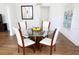 Bright dining area with glass-top table, seating for four, and stylish chandelier at 205 N Westland Ave, Tampa, FL 33606