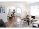 Open-concept living and dining area with hardwood floors, bright lighting and modern décor at 205 N Westland Ave, Tampa, FL 33606