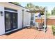 Outdoor patio area with pergola, lighting, seating, and a view of the fenced backyard at 205 N Westland Ave, Tampa, FL 33606