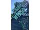 The Sparkman Wharf sign in bright turquoise, shows the locations and dining options in the wharf at 205 N Westland Ave, Tampa, FL 33606