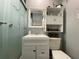Bathroom featuring vanity, storage, frosted glass shower doors and tiled shower at 21298 Austin Ave, Port Charlotte, FL 33952