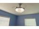 Stylish bedroom with a decorative ceiling fan and ample natural light, creating a relaxing ambiance at 21298 Austin Ave, Port Charlotte, FL 33952