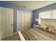 Inviting bedroom with a white bed frame, a closet with folding doors, and a tranquil blue color scheme at 21298 Austin Ave, Port Charlotte, FL 33952