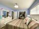 Serene bedroom featuring a white bed frame, a dresser, and ample closet space for comfortable living at 21298 Austin Ave, Port Charlotte, FL 33952