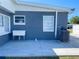 Exterior of the home with a sink, an air conditioner, and windows at 21298 Austin Ave, Port Charlotte, FL 33952