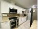 Modern kitchen with stainless steel appliances, granite countertops and subway tile backsplash at 21298 Austin Ave, Port Charlotte, FL 33952