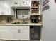 Kitchen sink with modern faucet, updated countertops and coffee bar at 21298 Austin Ave, Port Charlotte, FL 33952