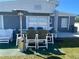 Back patio with patio furniture, a patio heater, and a backyard view at 21298 Austin Ave, Port Charlotte, FL 33952