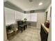 Cozy sun room features natural lighting, neutral paint, and tile flooring at 21298 Austin Ave, Port Charlotte, FL 33952