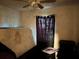 Bedroom featuring a ceiling fan and window with curtains for privacy at 2610 E 26Th Ave, Tampa, FL 33605