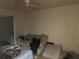 Bedroom showcasing a neutral sofa and a partially visible bed at 2610 E 26Th Ave, Tampa, FL 33605