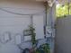 Image shows an electrical meter and a few electrical boxes mounted to the side of a home at 2610 E 26Th Ave, Tampa, FL 33605