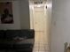 View of hallway featuring tile floors, white walls, and doors to rooms at 2610 E 26Th Ave, Tampa, FL 33605