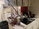 Picture of kitchen featuring dated appliances, laminate counters, and tile floors at 2610 E 26Th Ave, Tampa, FL 33605