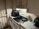 Picture of kitchen featuring dated appliances, tiled walls, and tile countertops at 2610 E 26Th Ave, Tampa, FL 33605