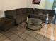 Spacious living room featuring a large sectional sofa and glass-top coffee table at 2610 E 26Th Ave, Tampa, FL 33605