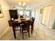 An open floor plan connects the dining area to a modern kitchen with stainless appliances at 2625 State Road 590 # 2613, Clearwater, FL 33759