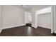 Bedroom featuring laminate flooring, neutral paint, closet and bright lighting at 2702 W Braddock St, Tampa, FL 33607