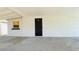 Image of a covered patio featuring a small window, textured walls and concrete flooring at 2702 W Braddock St, Tampa, FL 33607