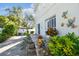 Spacious brick patio featuring colorful accents and manicured plants at 2721 W Gray St, Tampa, FL 33609